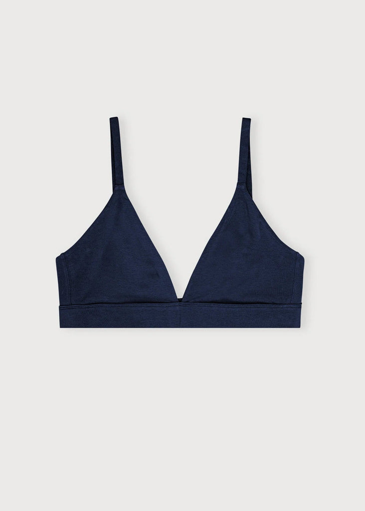 Navy blue bralette on a light gray background