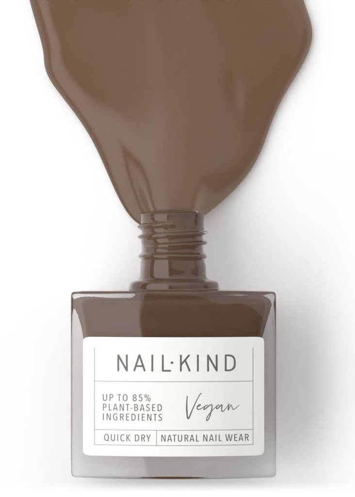 Nail polish bottle with brown nail polish and 'Nail Kind' label on a white background