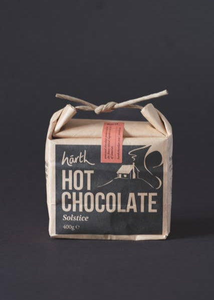 Box of hot chocolate with a rustic design on a dark background