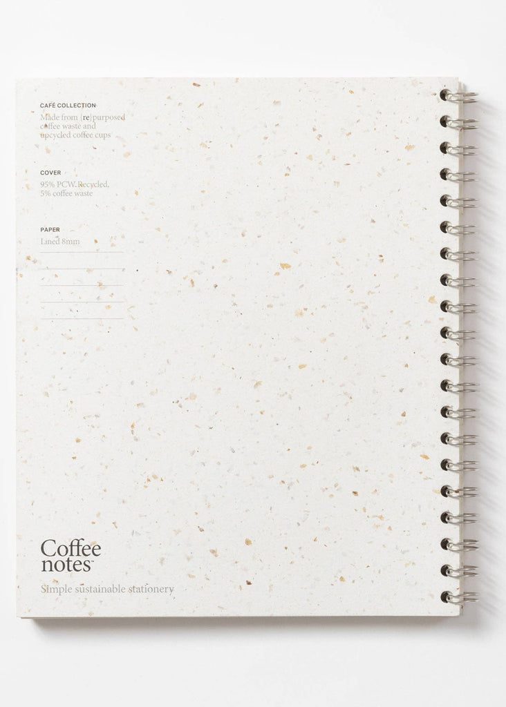 Spiral-bound notebook with speckled cover on a white background