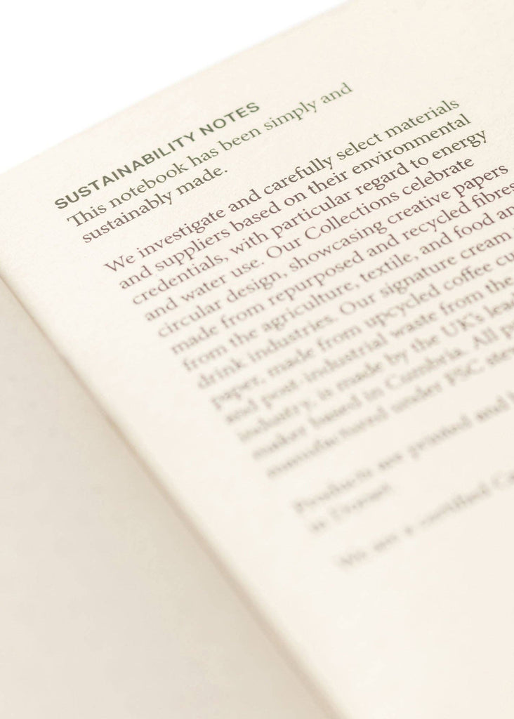 Open book with text on sustainability and eco-friendly practices.