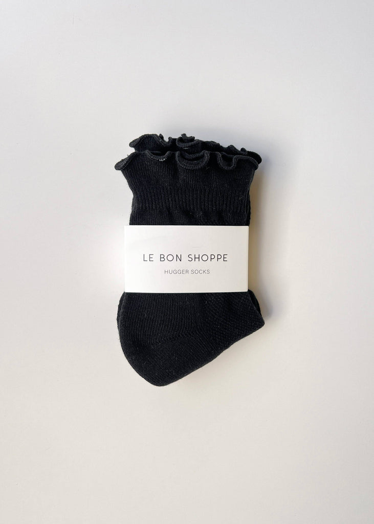 Black socks with floral details on a white background, featuring 'Le Bon Shoppe' branding.