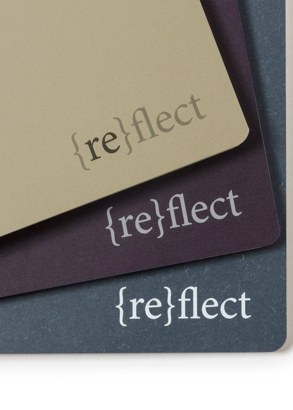 Three 'reflect' branded cards in different colors on a white background