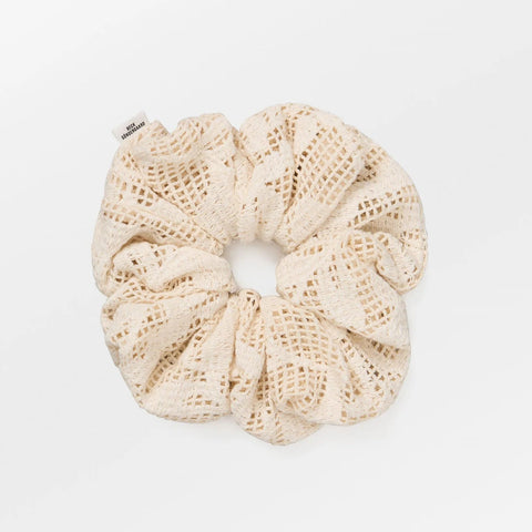 Beige crochet scrunchie on a white background