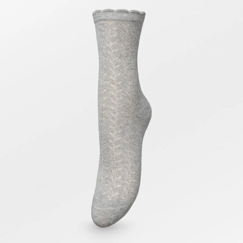 A single light gray knit sock with a subtle chevron pattern, shown floating against a clean white background.